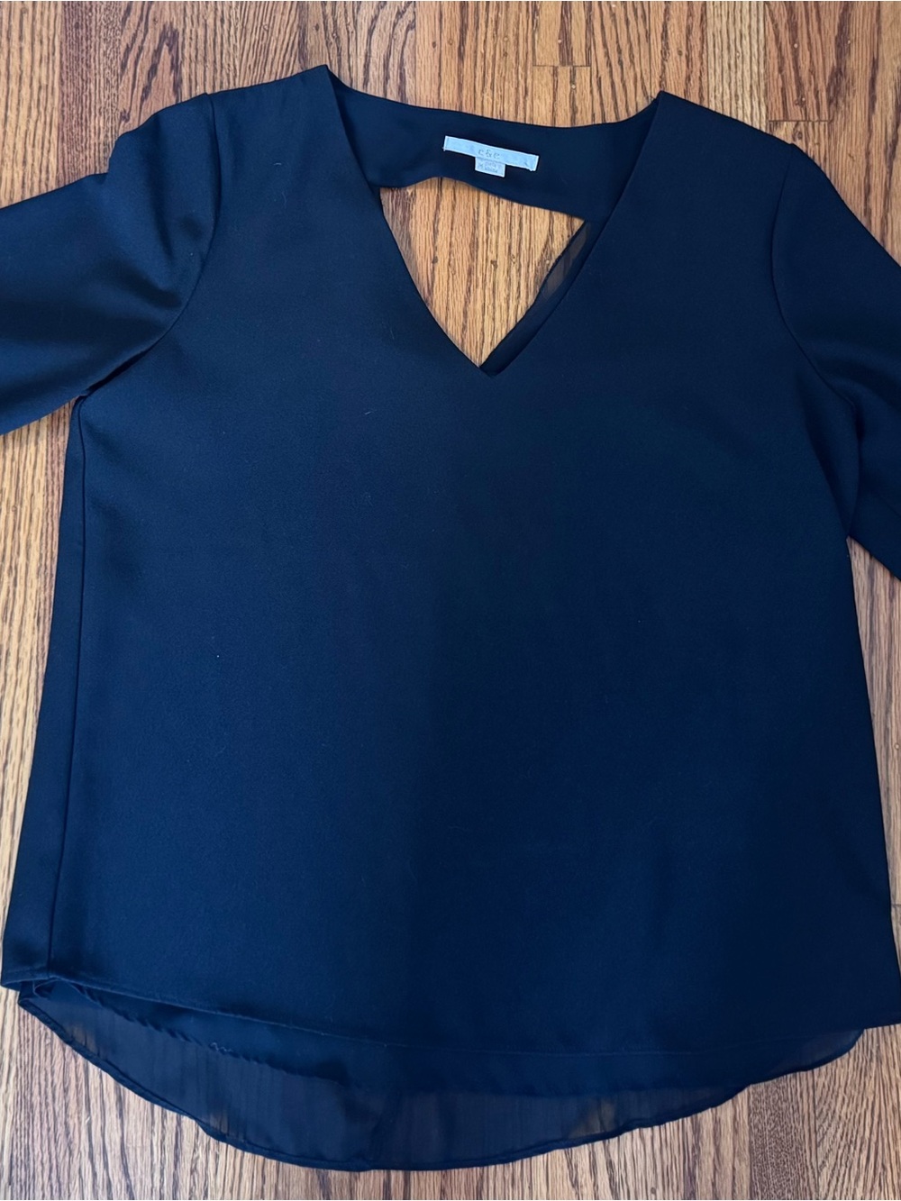 Women's Black V-Neck Blouse with Chiffon Hem